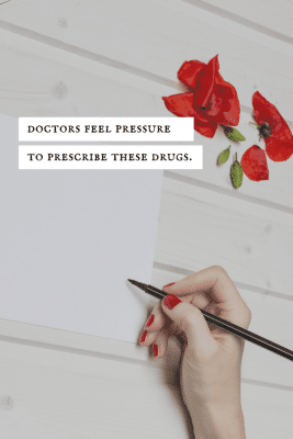 Woman writing on a piece of paper.