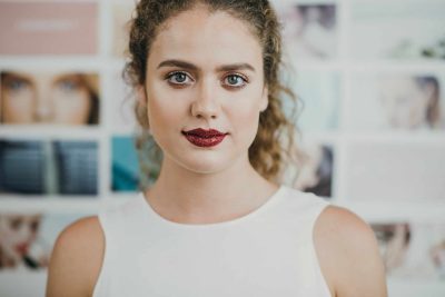 Woman in white shirt.