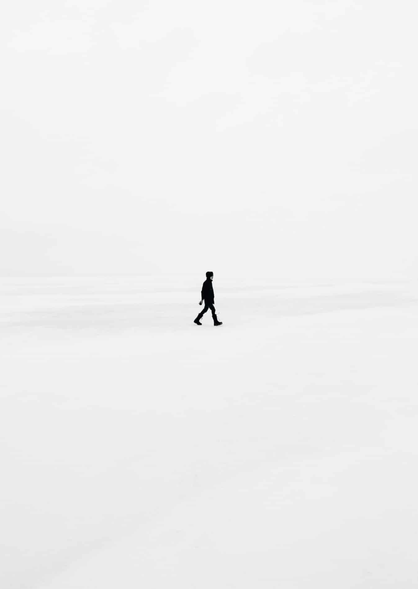 Person walking alone in a blizzard.