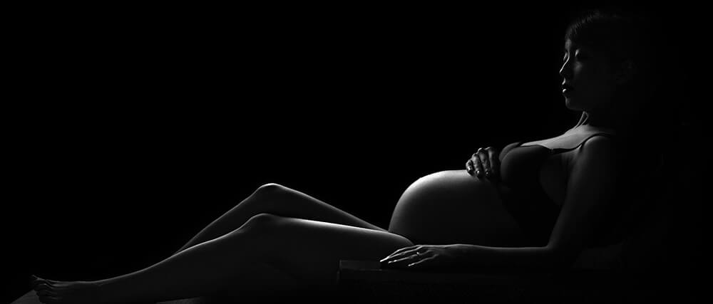 Pregnant woman lying down.