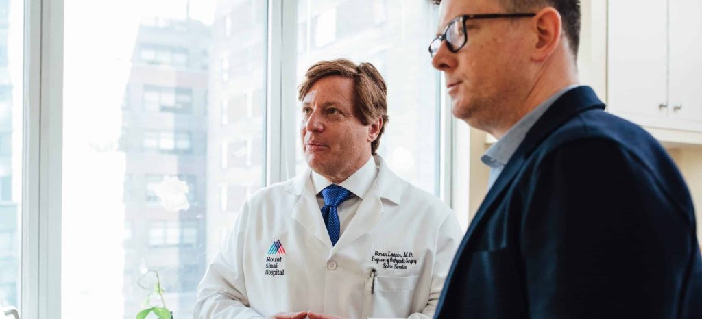 Physician and contractor having a meeting.