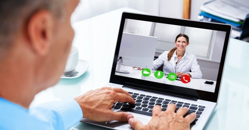 Patient meeting with his doctor over video call.