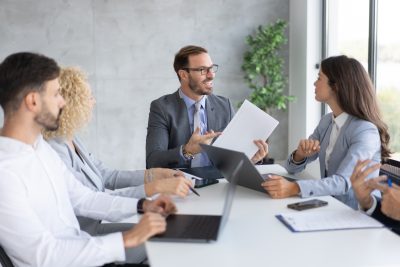 Physicians reviewing medical practice ownership and business structure with healthcare professionals