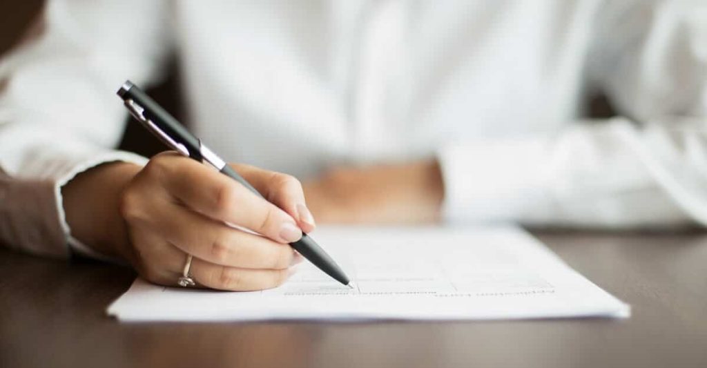 Employer reviewing over an employment contract.