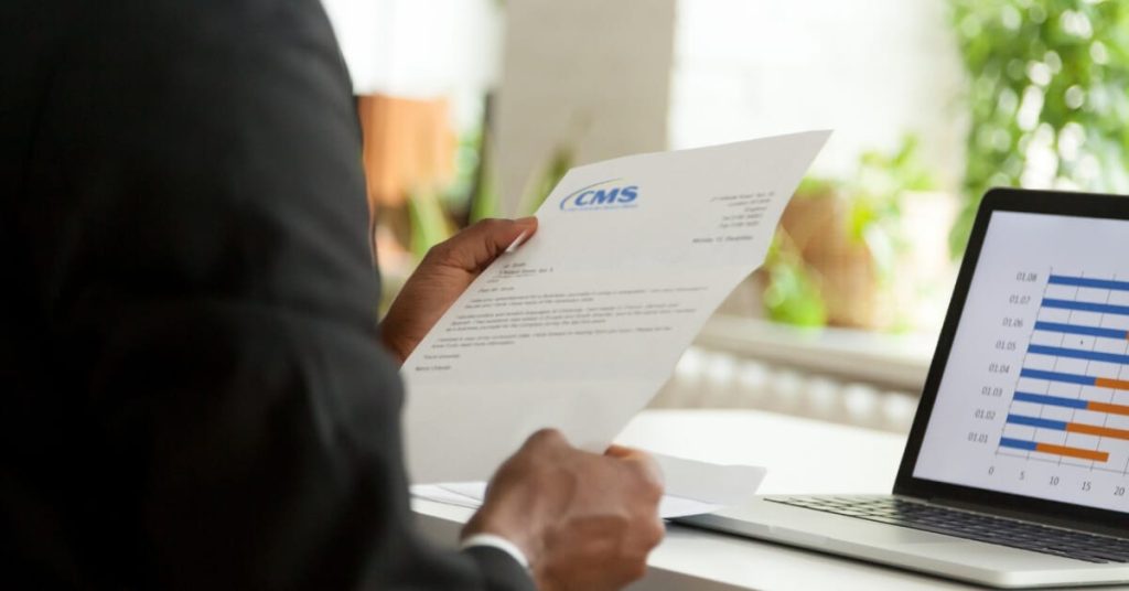 Company owner reading over a UPIC letter.