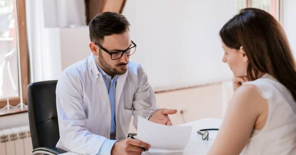 Clinician discussing a privacy agreement with a patient.