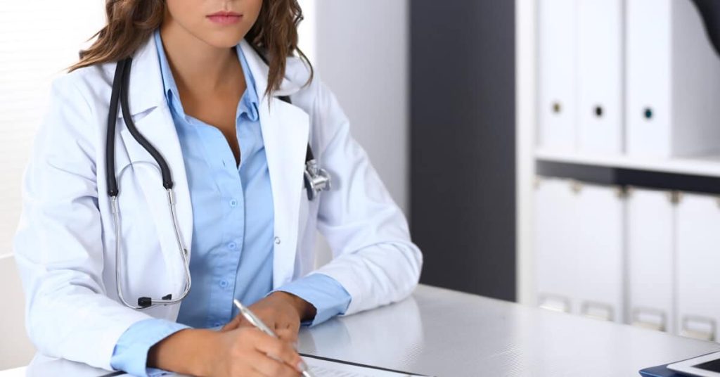 A physician doing paperwork
