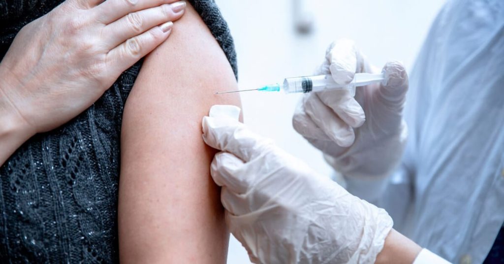 Doctor administering a vaccine