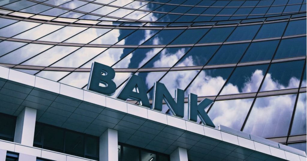 Facade of a modern glass bank building.