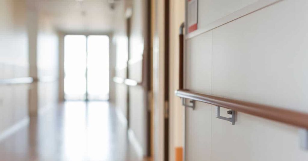 An empty corridor in a healthcare facility.