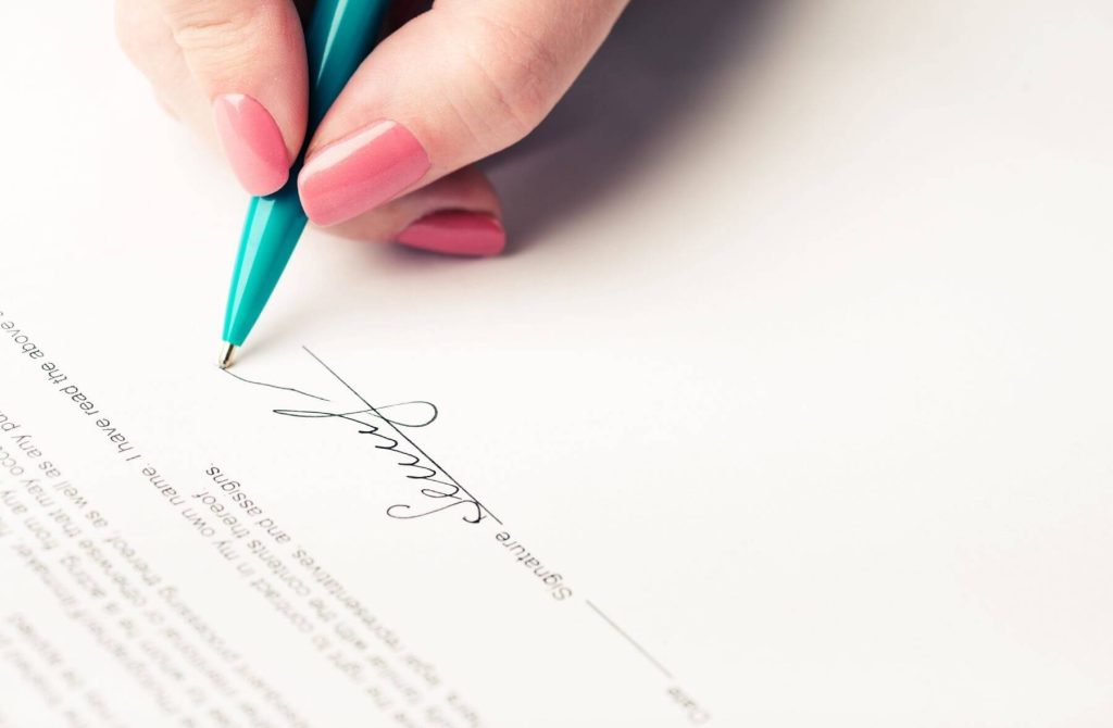 Woman signing healtcare contract