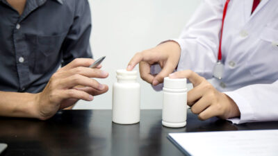 Physician reviewing private label products in a medical practice.