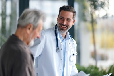 Physicians discussing direct primary care legal requirements